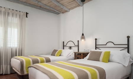 Dormitorio del apartamento Petunia en La Jabega by Conil Home