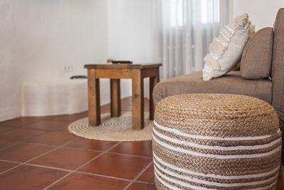 Rustic details of rug and puff made with natural ratia